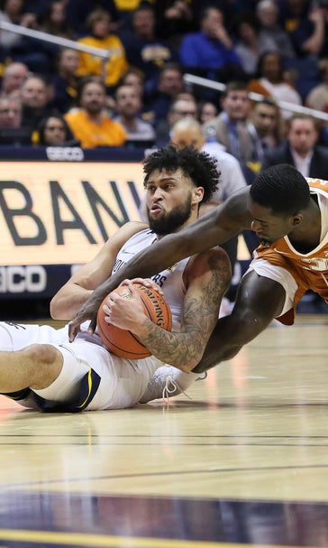 No. 14 West Virginia cruises to 97-59 win over Texas